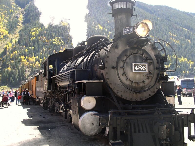 Steam train in mountain valley