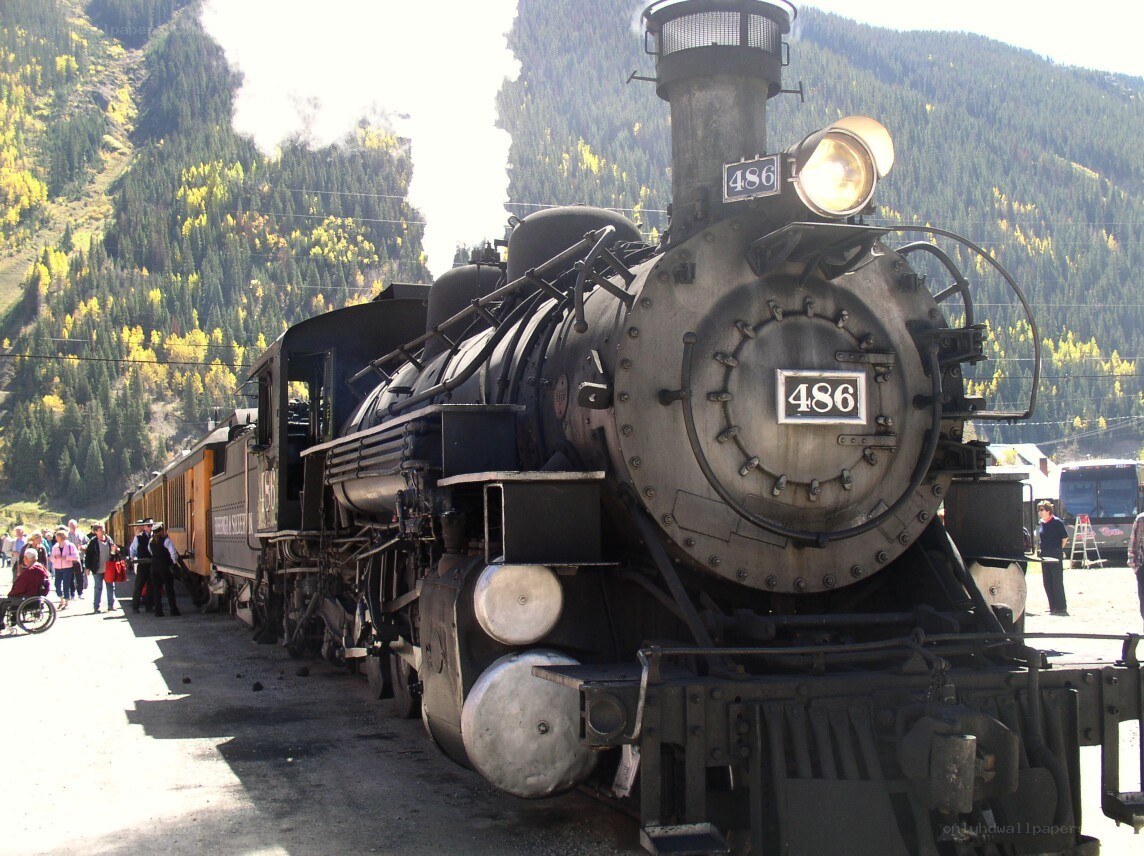 Steam train in mountain valley