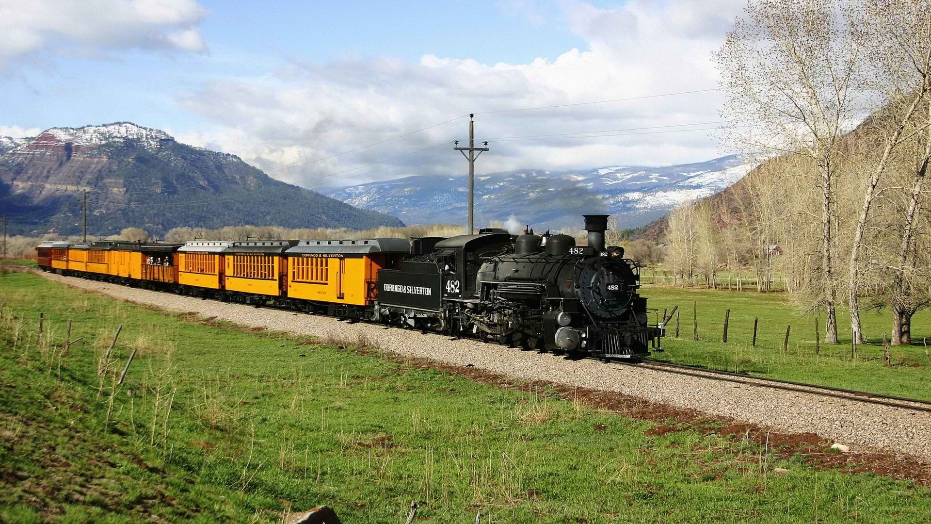 Steam train in mountain valley