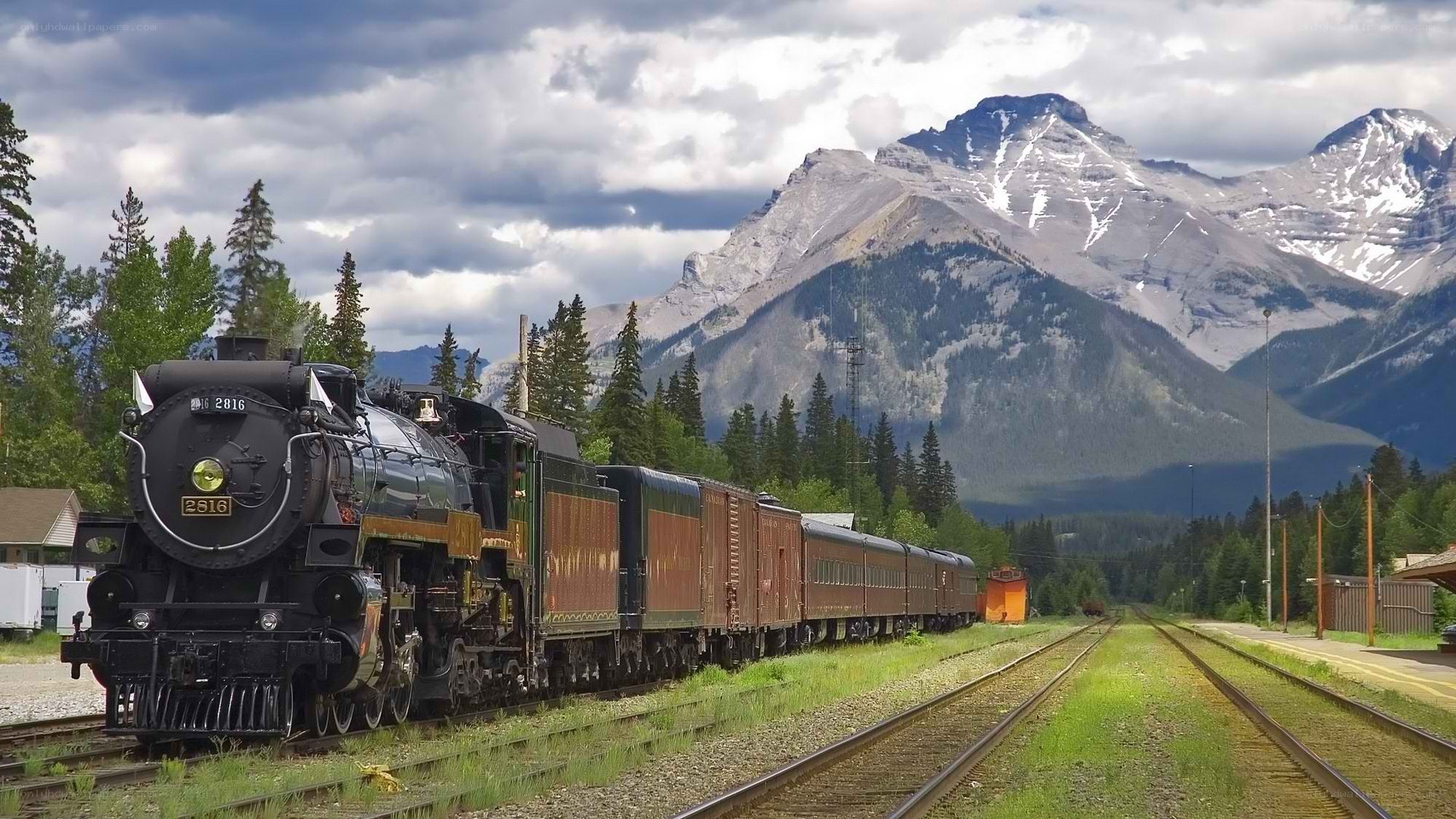 Steam train in mountain valley