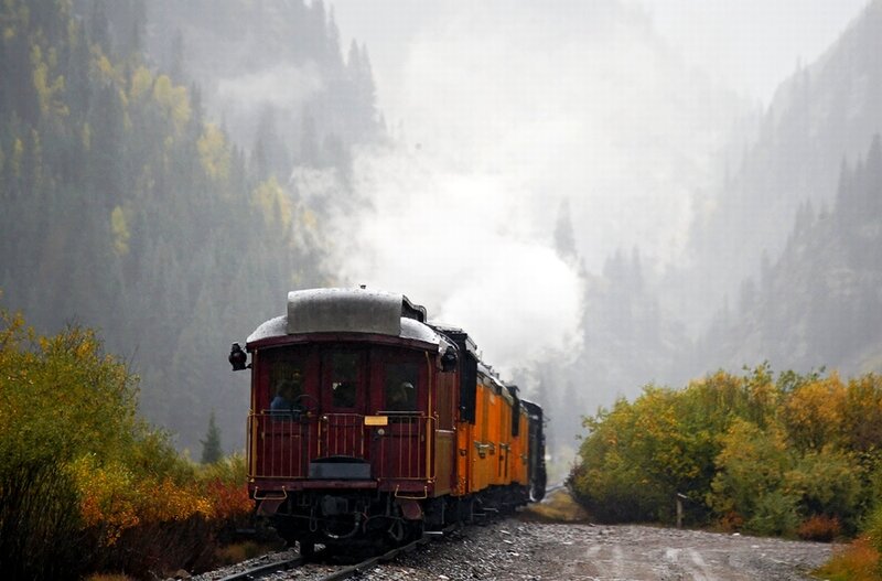 Steam train in mountain valley