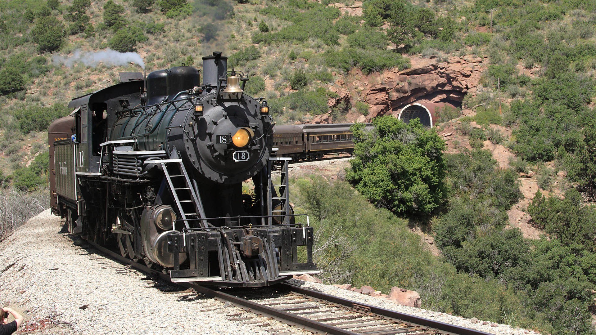 Steam train in mountainous terrain