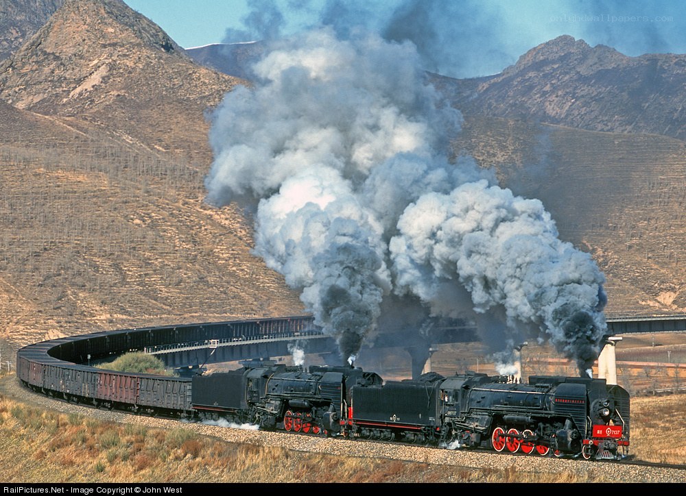Steam train in mountainous terrain