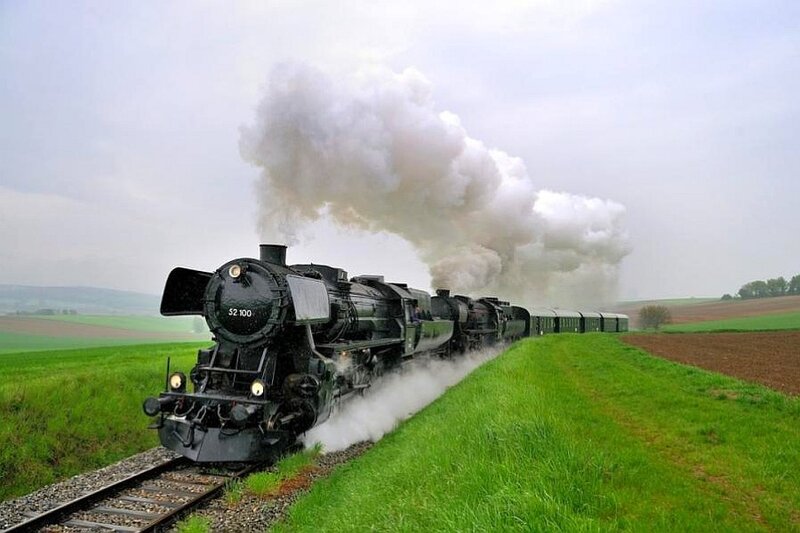 Steam train in rural landscape