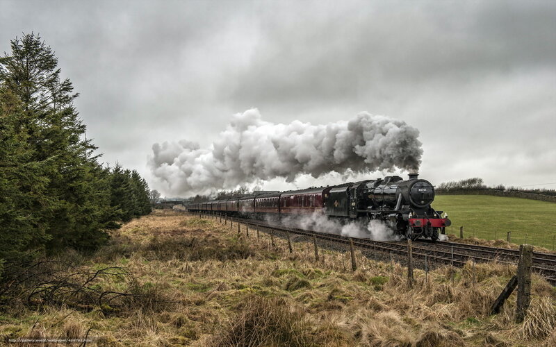 Steam train in rural landscape
