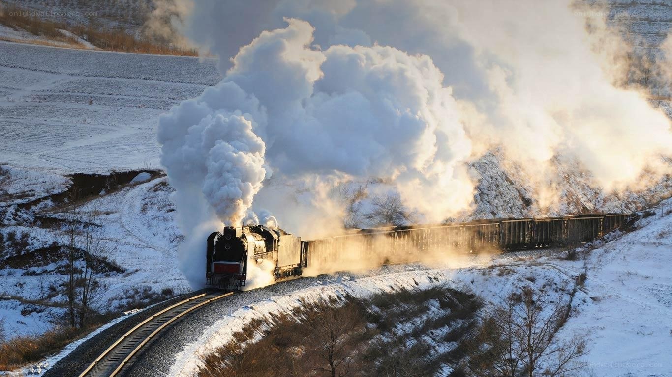 Steam train in snowy landscape