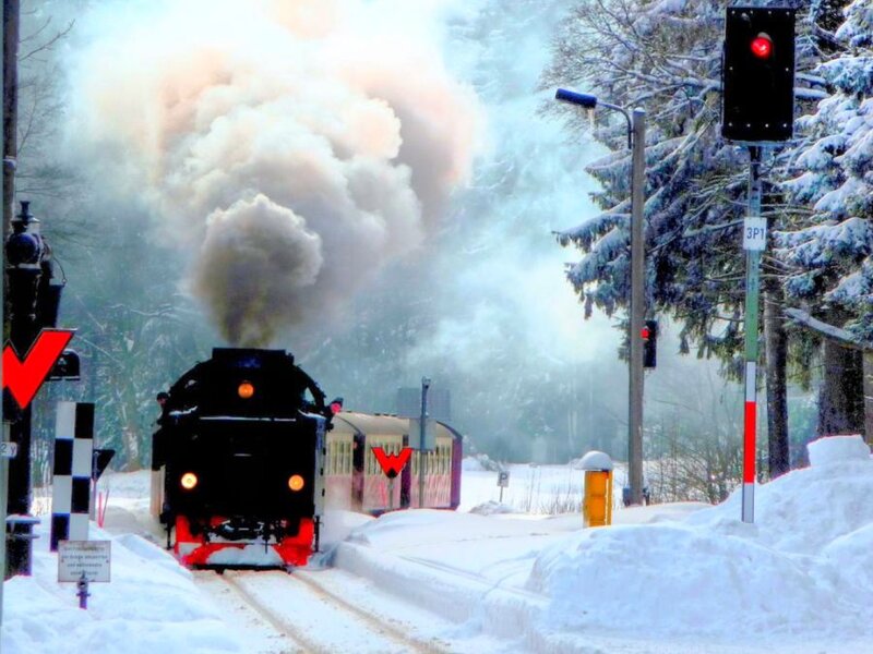 Steam train in snowy landscape
