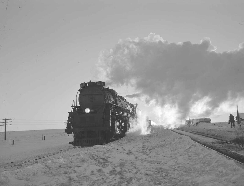 Steam train in snowy landscape