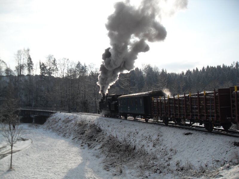 Steam train in snowy landscape