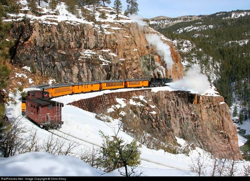 Steam train in snowy mountains