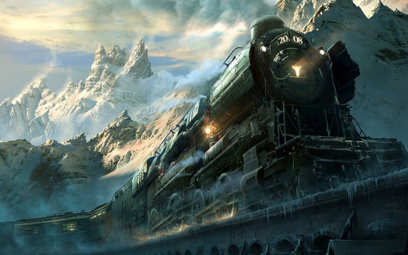 Steam train in snowy mountains
