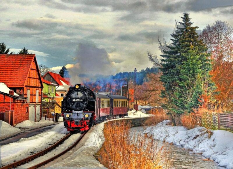 Steam train in snowy village