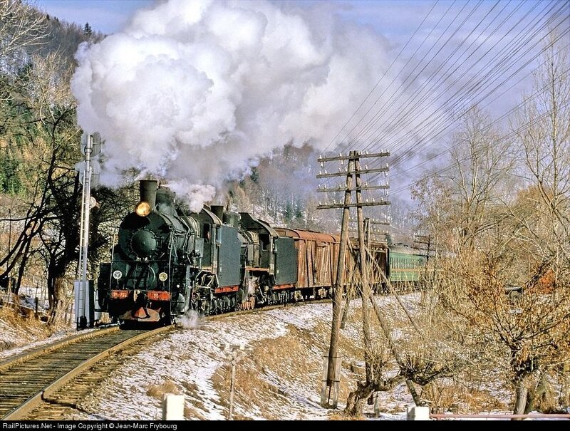 Steam train in winter landscape