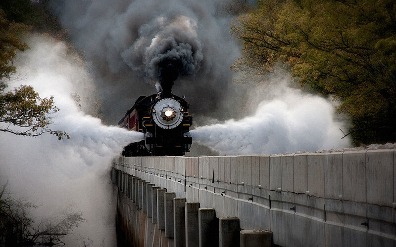 Steam train on a bridge