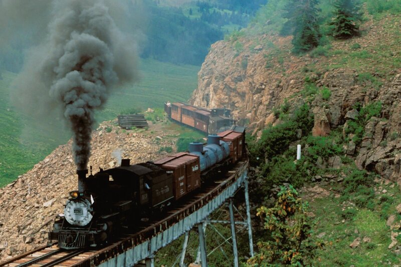 Steam train on a mountain bridge