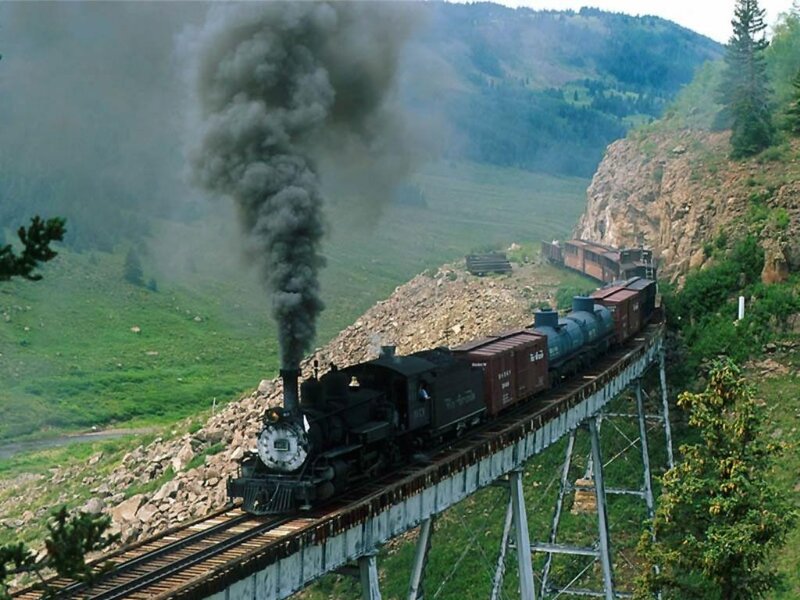Steam train on a mountain bridge