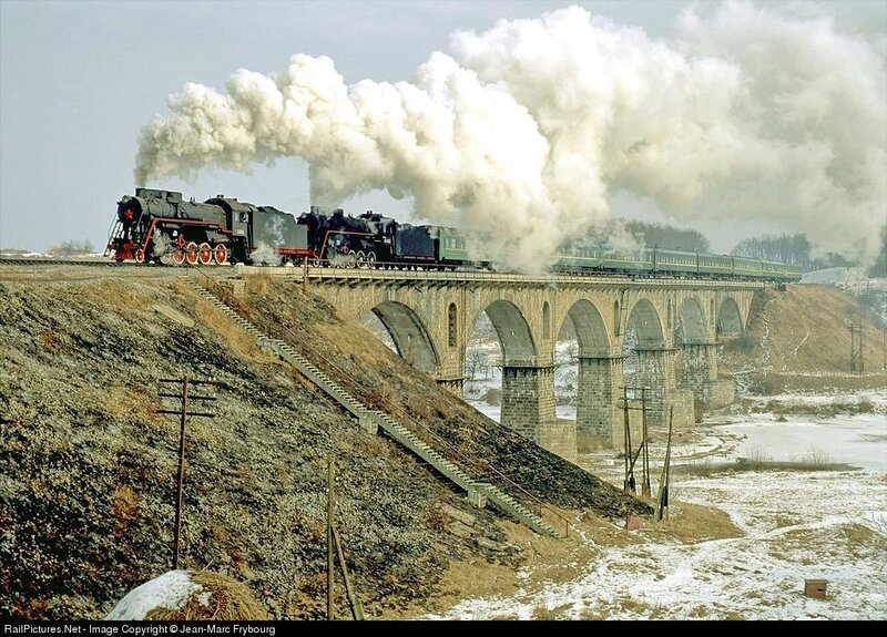 Steam train on a stone bridge