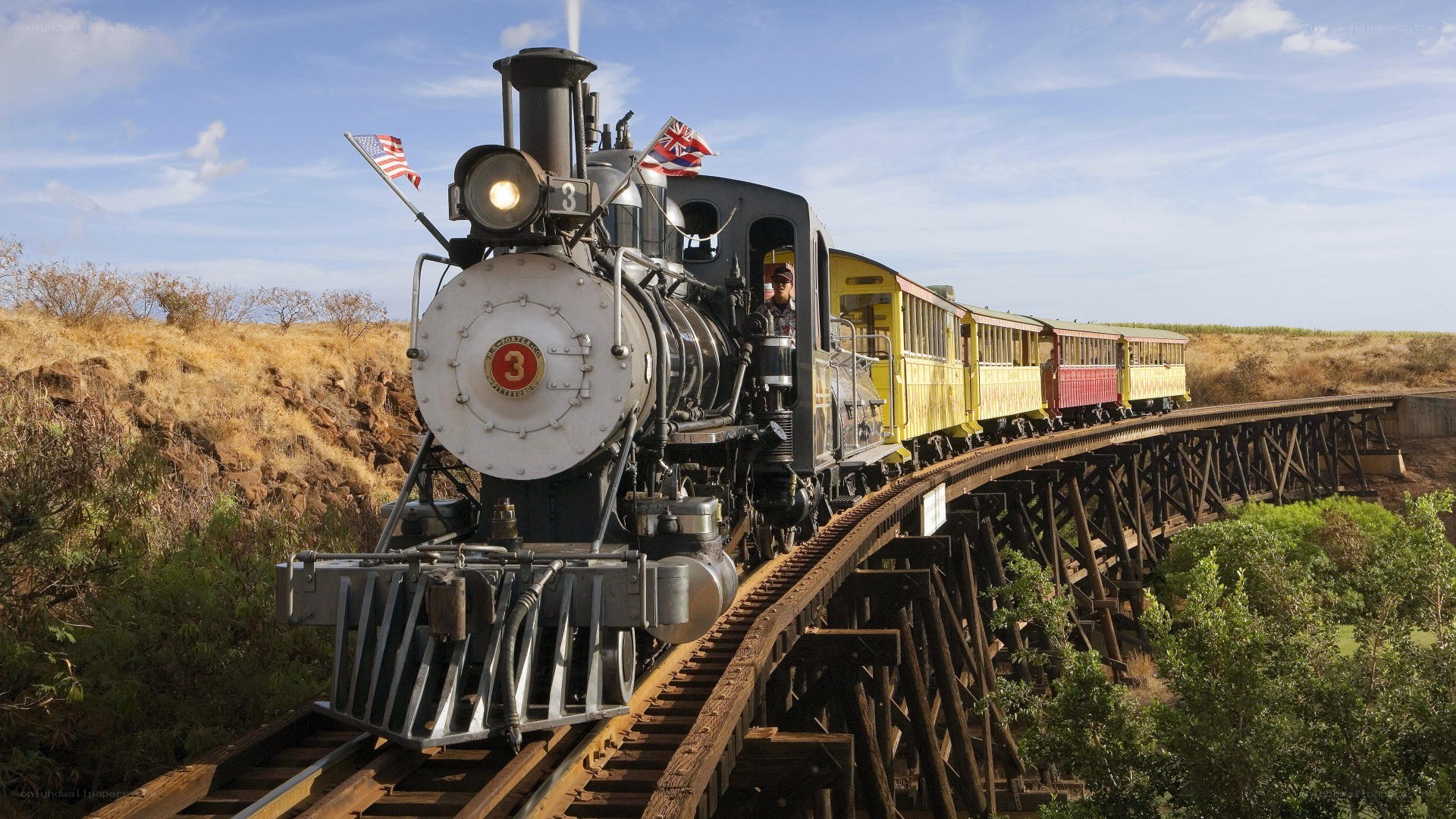 Steam train on a wooden bridge