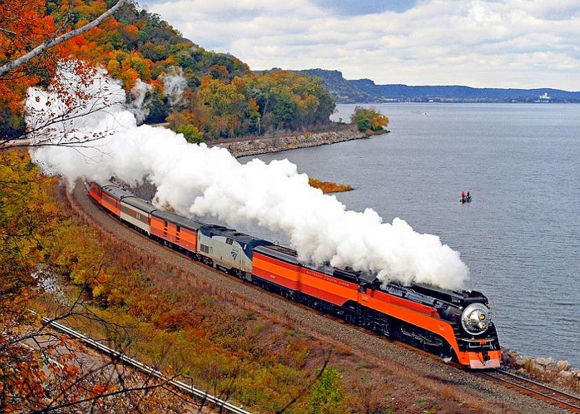 Steam train on autumn river