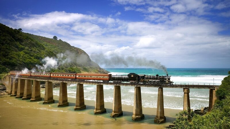 Steam Train on Bridge — Blue, Dramatic, Afternoon, Photograph, Ocean, Cliff
