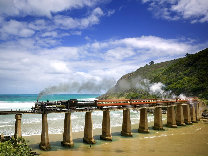 Steam Train on Bridge — Blue, Serene, Afternoon