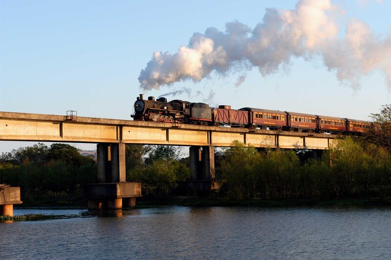 Steam Train on Bridge — Blue, Serene, Sunset