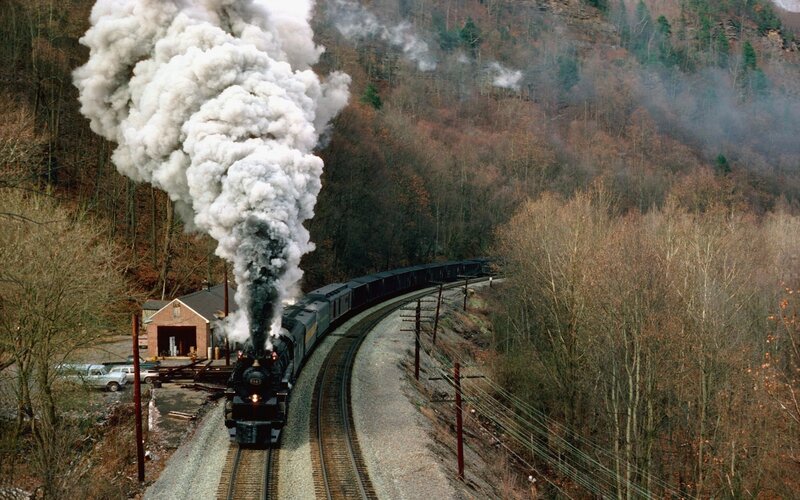 Steam Train on Mountain Track — Gray, Dramatic