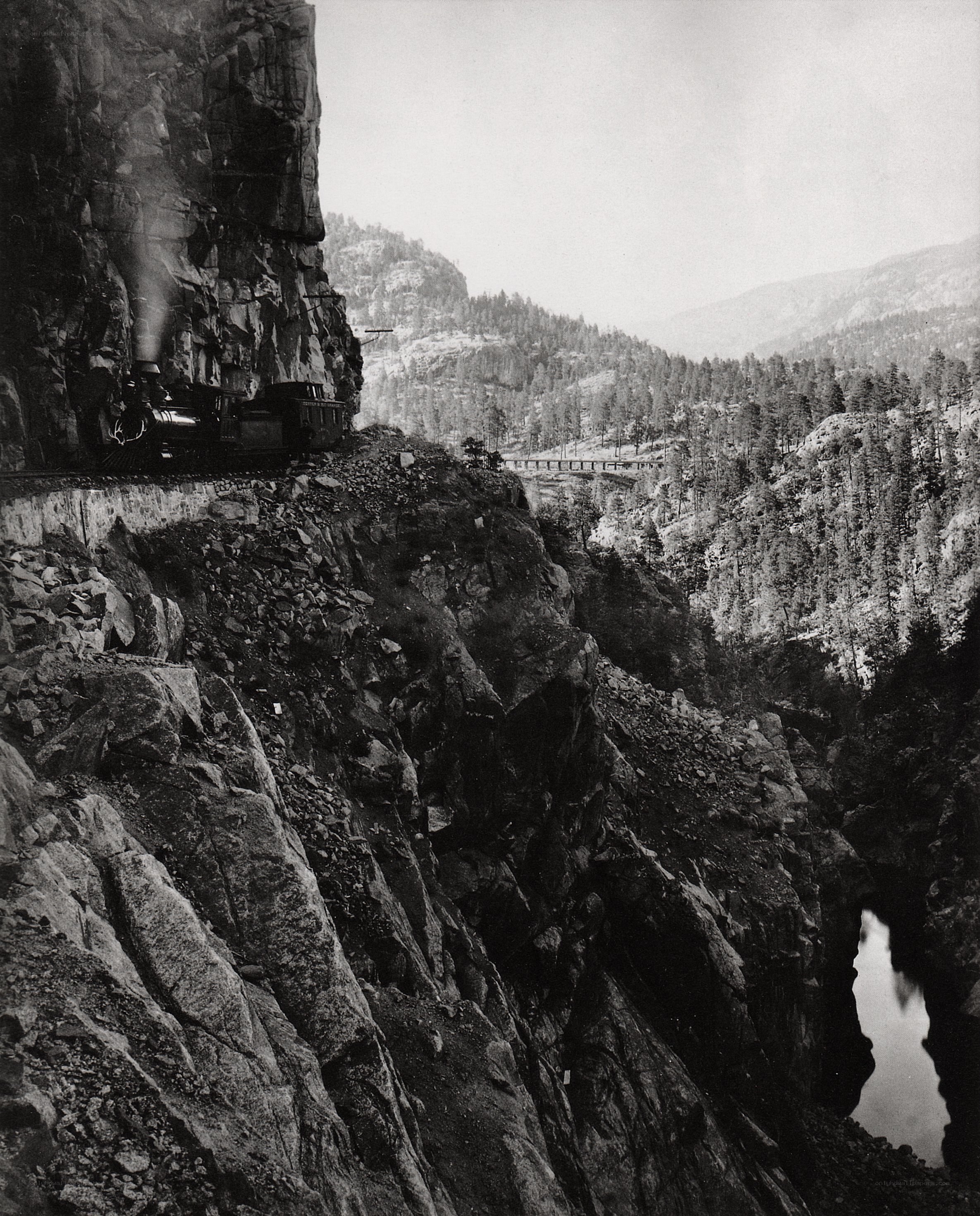 Steam train on mountain track