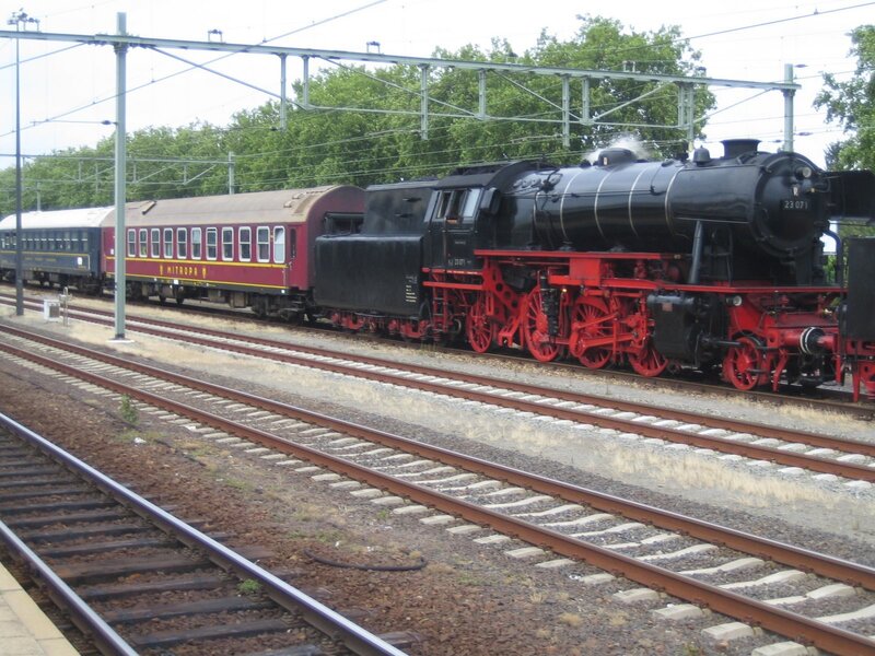 Steam train on railway tracks