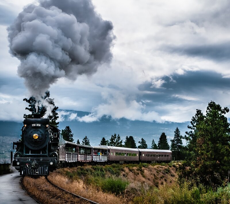 Steam Train on Track — Gray, Dramatic, Photograph, Smoke, Mountains