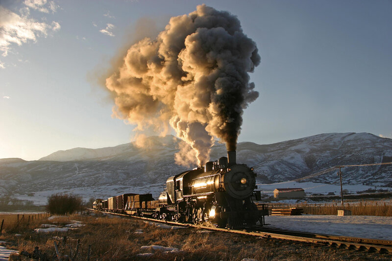 Steam Train on Tracks — Black, Dramatic, Winter