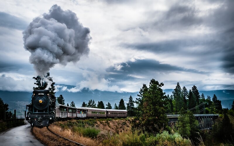 Steam Train on Tracks — Gray, Dramatic, Afternoon