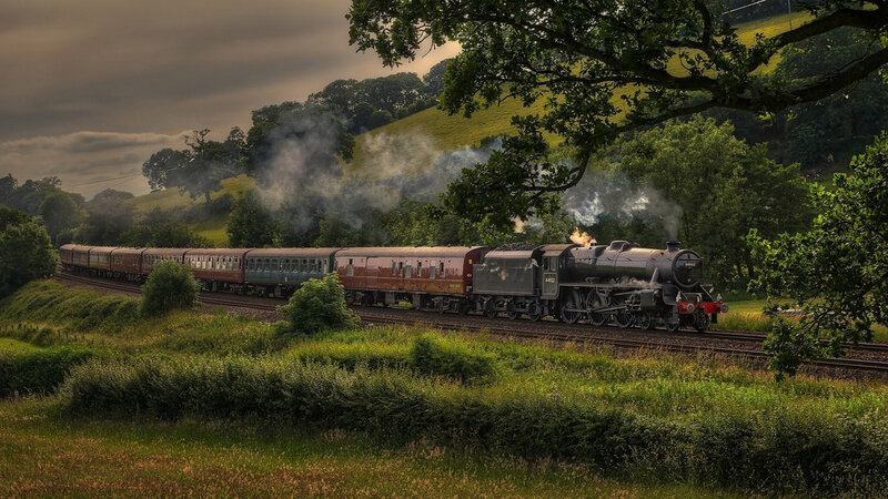 Steam Train on Tracks — Green, Dramatic, Afternoon, Photograph, Smoke