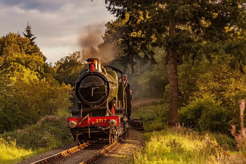 Steam Train on Tracks — Green, Dramatic, Sunset, Photograph