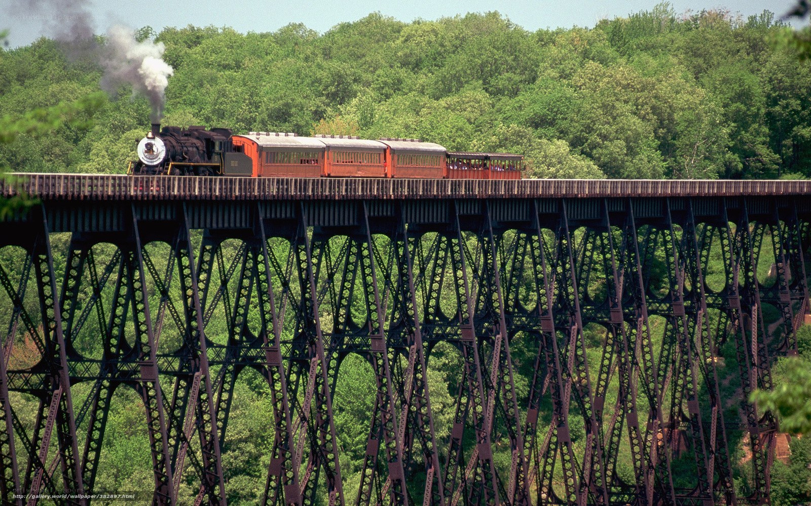 Steam train on trestle bridge