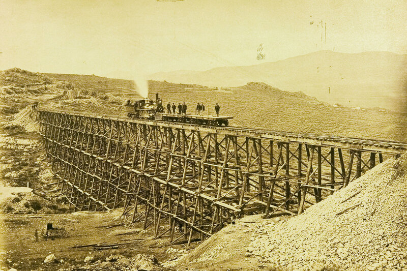 Steam train on wooden trestle