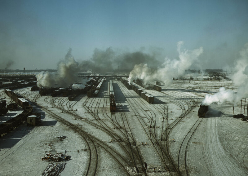 Steam trains at a rail yard