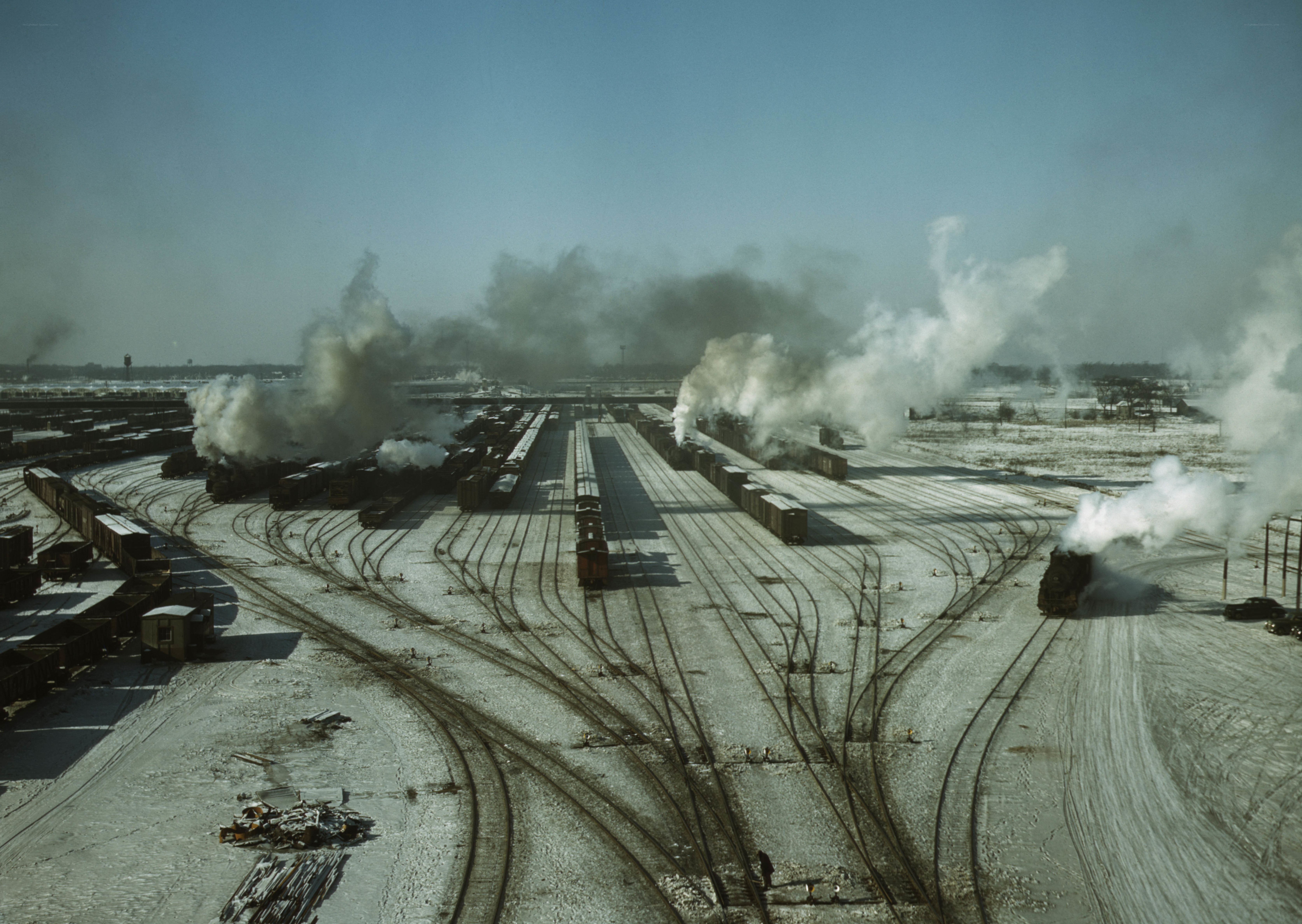 Steam trains at a rail yard