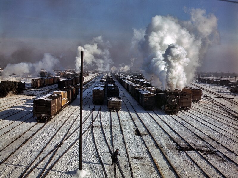 Steam trains in a snowy yard