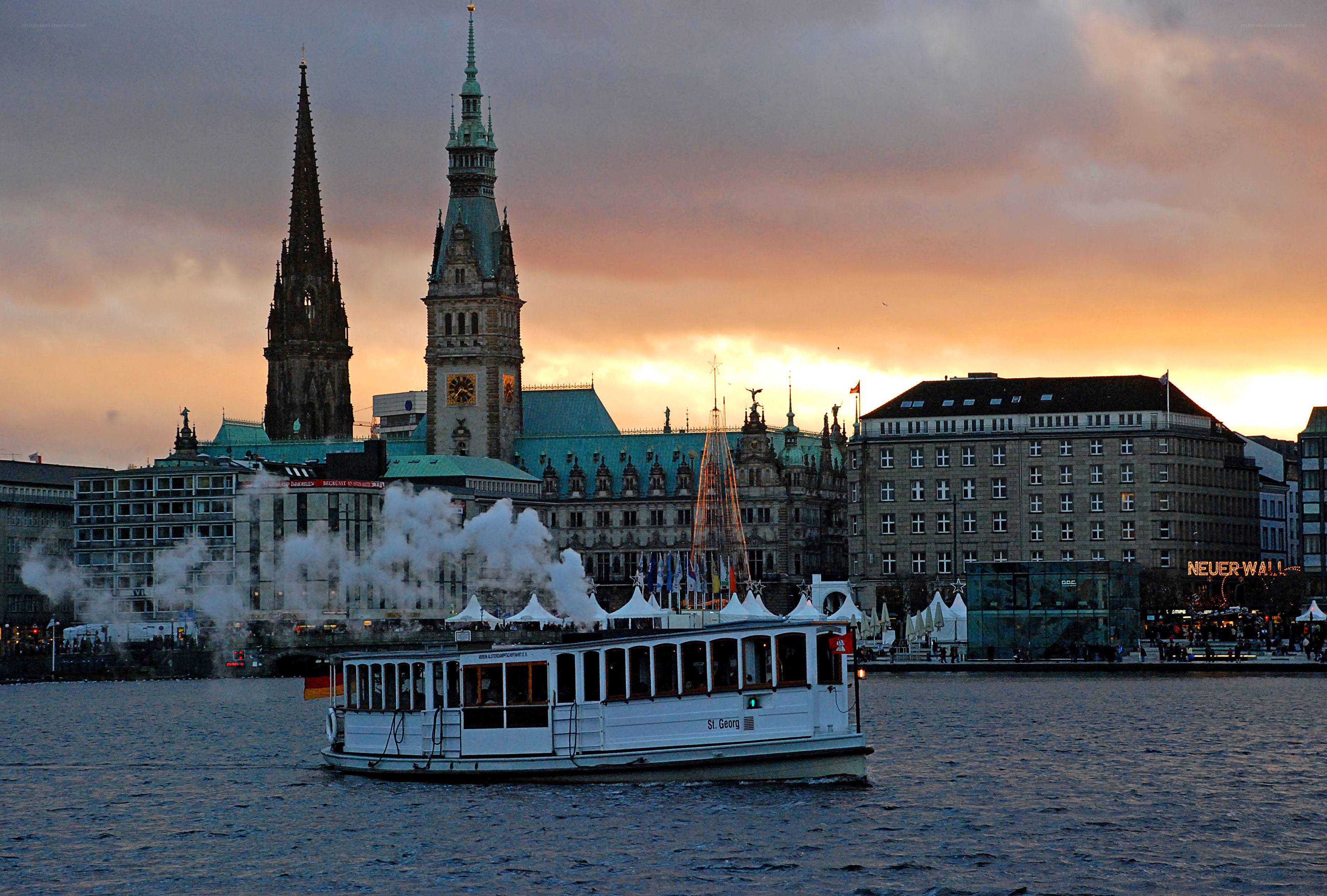 Steamboat on river at sunset
