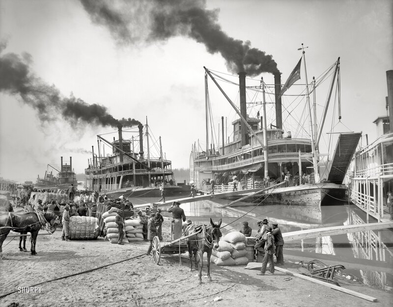 Steamboats at a busy river dock