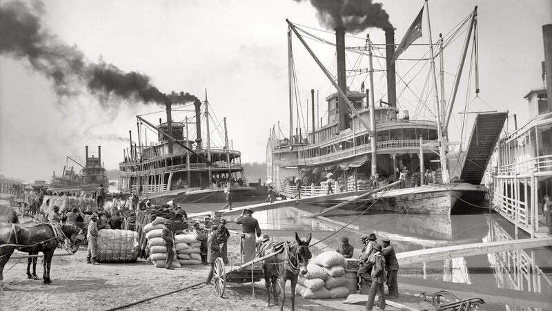 Steamboats at a busy river port
