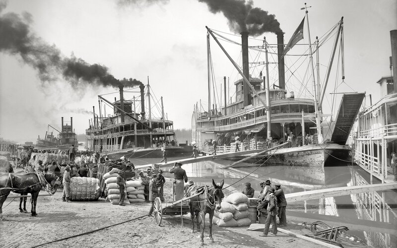 Steamboats at a busy river port