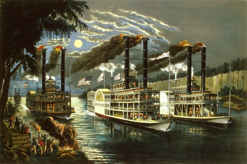 Steamboats on a river at night