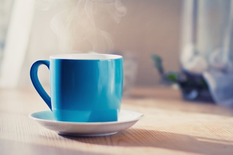 steaming blue coffee cup
