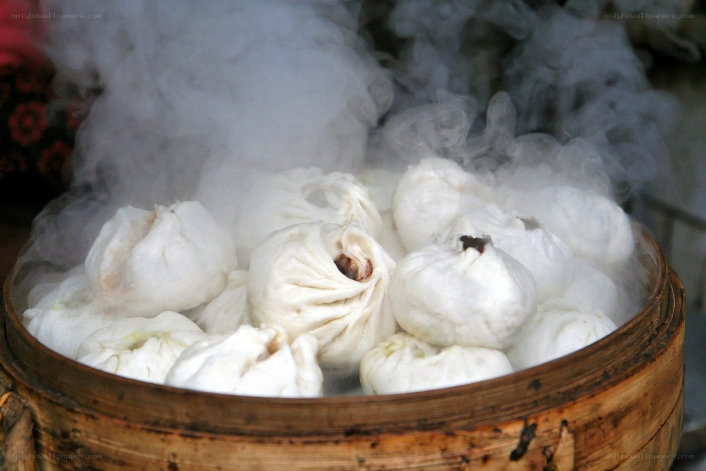 steaming buns in bamboo basket