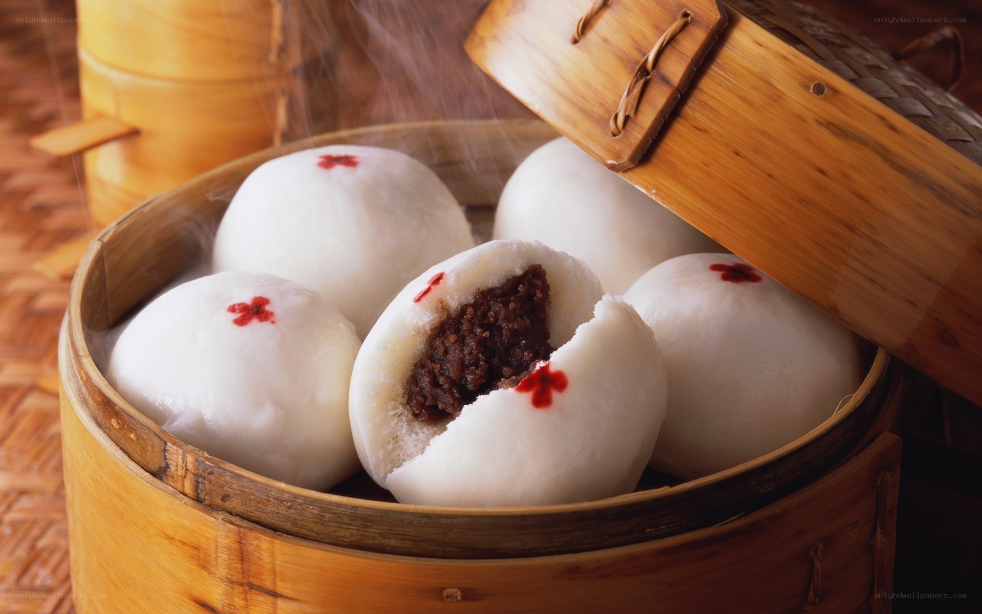 Steaming buns in bamboo basket