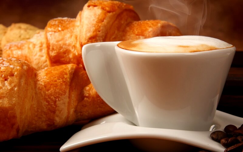 Steaming Cappuccino and Croissant