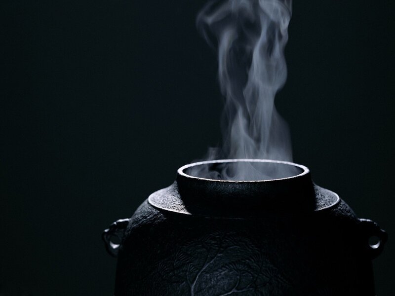 Steaming Ceramic Pot — Black, Dramatic