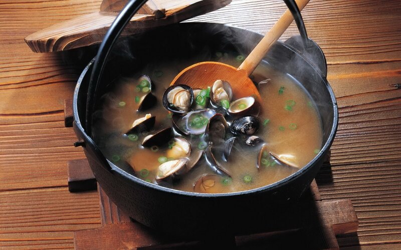 steaming clam soup in a pot